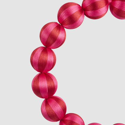 Large fuchsia and red striped bauble wreath