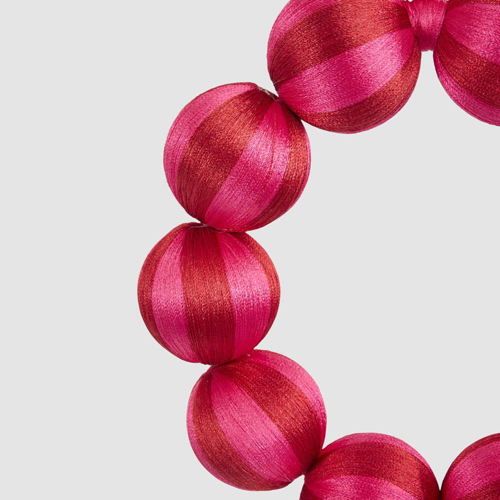 Small fuchsia and red striped bauble wreath
