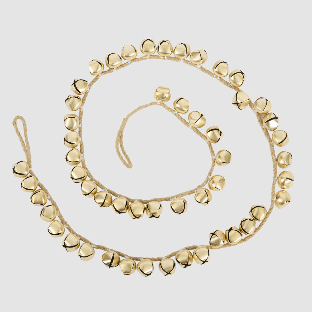 Gold bell garland coiled with round bells spaced along natural cord