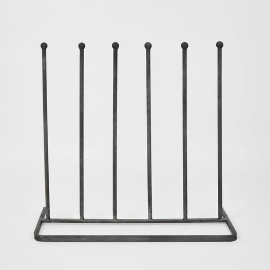 A metal 6-candle menorah stand with a rectangular base and six uprights topped with small round balls, shown against a plain white background.
