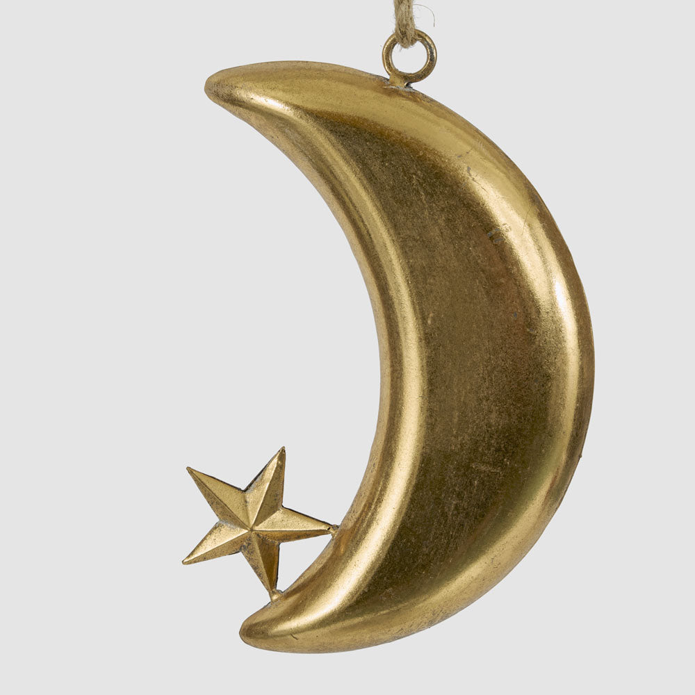 Large gold crescent moon hanging decoration in an angled view showing its curved shape and small star