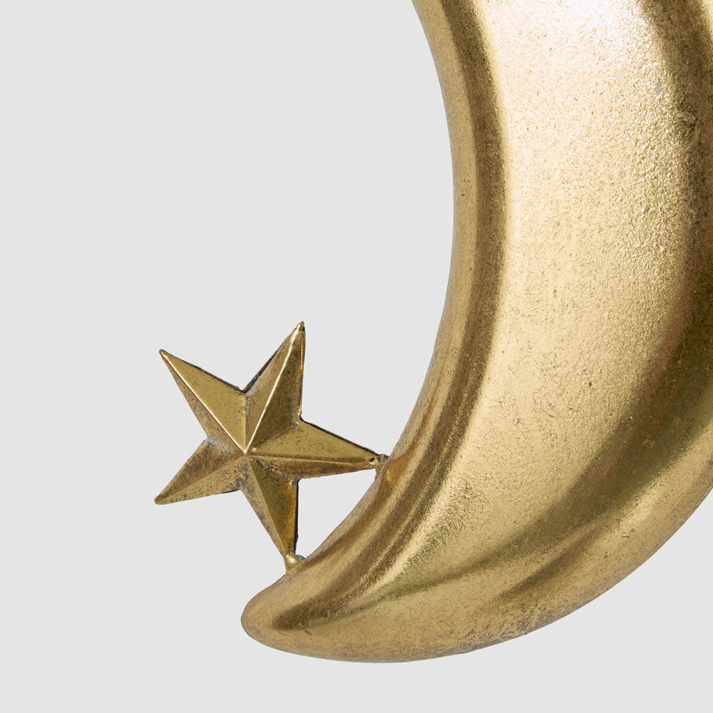 Large gold crescent moon hanging decoration close-up showing the faceted star and textured gold crescent