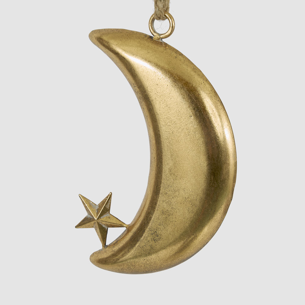 Small gold crescent moon hanging decoration in an angled view showing its curved shape and small star