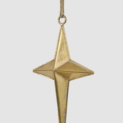 Small gold metal star hanging decoration in an angled view showing its folded metal shape