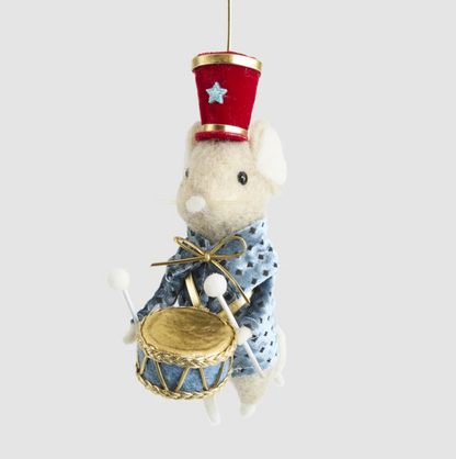 Side view of the drummer mouse decoration showing its blue coat, red hat, drumsticks and tail
