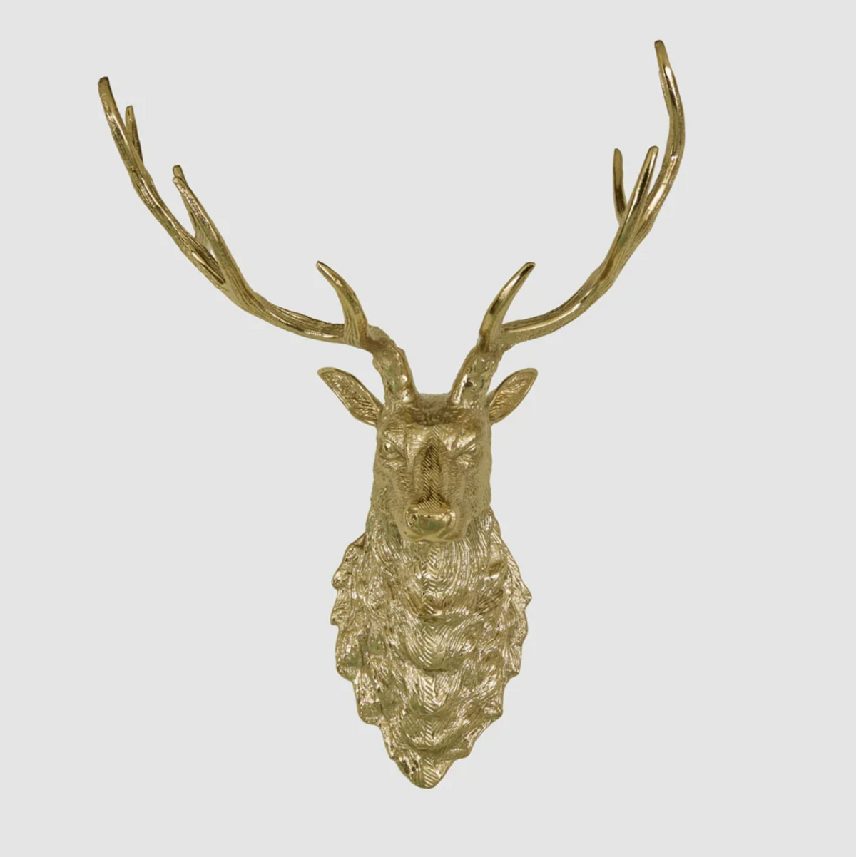 Angled view of a gold-coloured wall-mounted deer head with branching antlers and textured fur detail