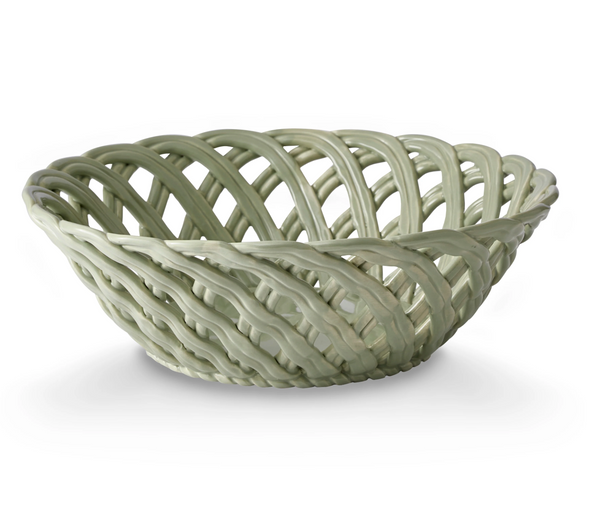Light green ceramic bowl with an open woven lattice design on a white background