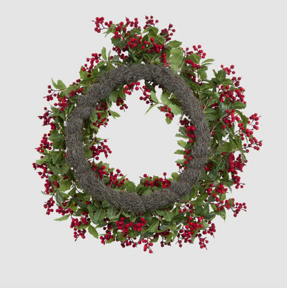 Back view of the holly and red berry wreath showing its circular backing