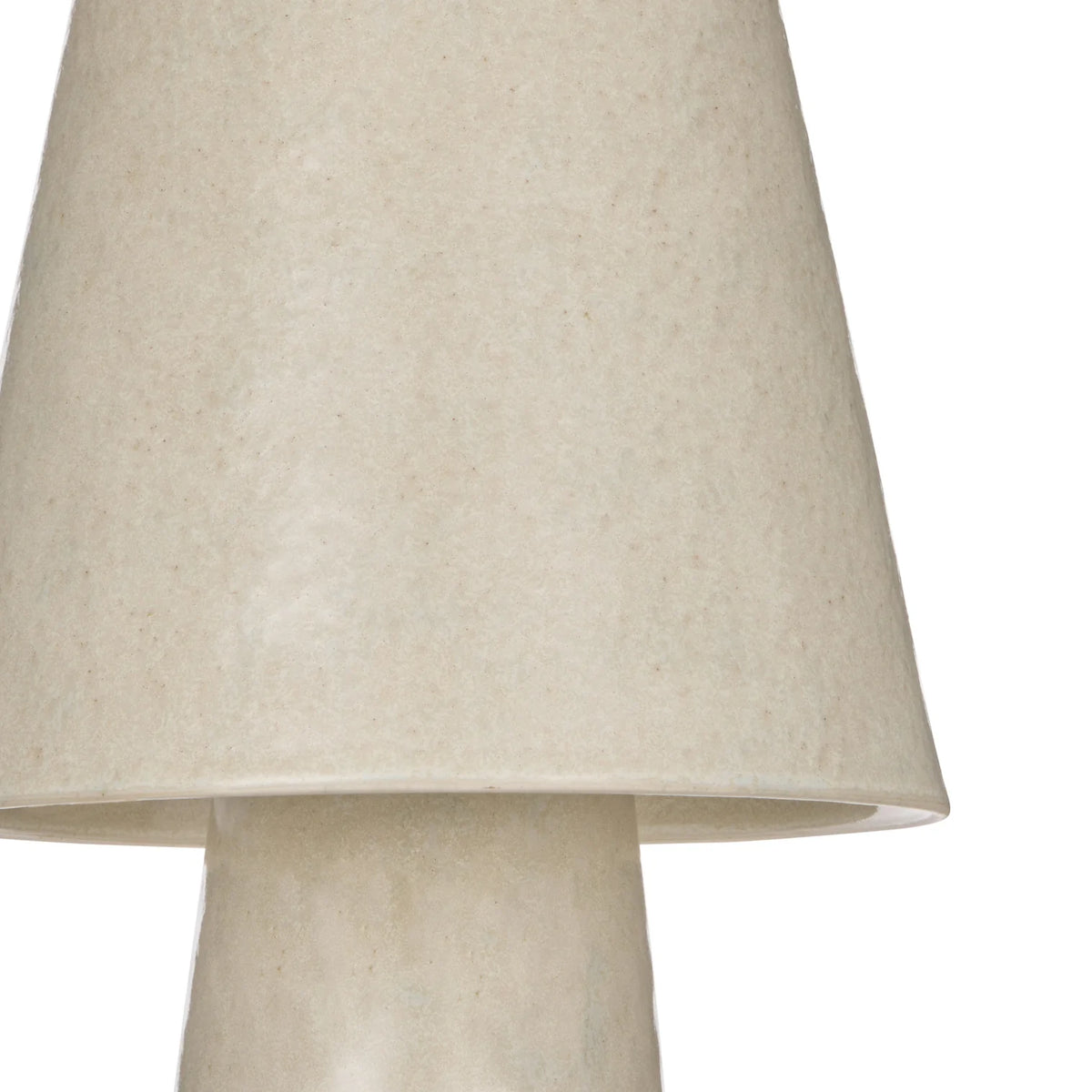 Textured ivory ceramic table lamp on a white background