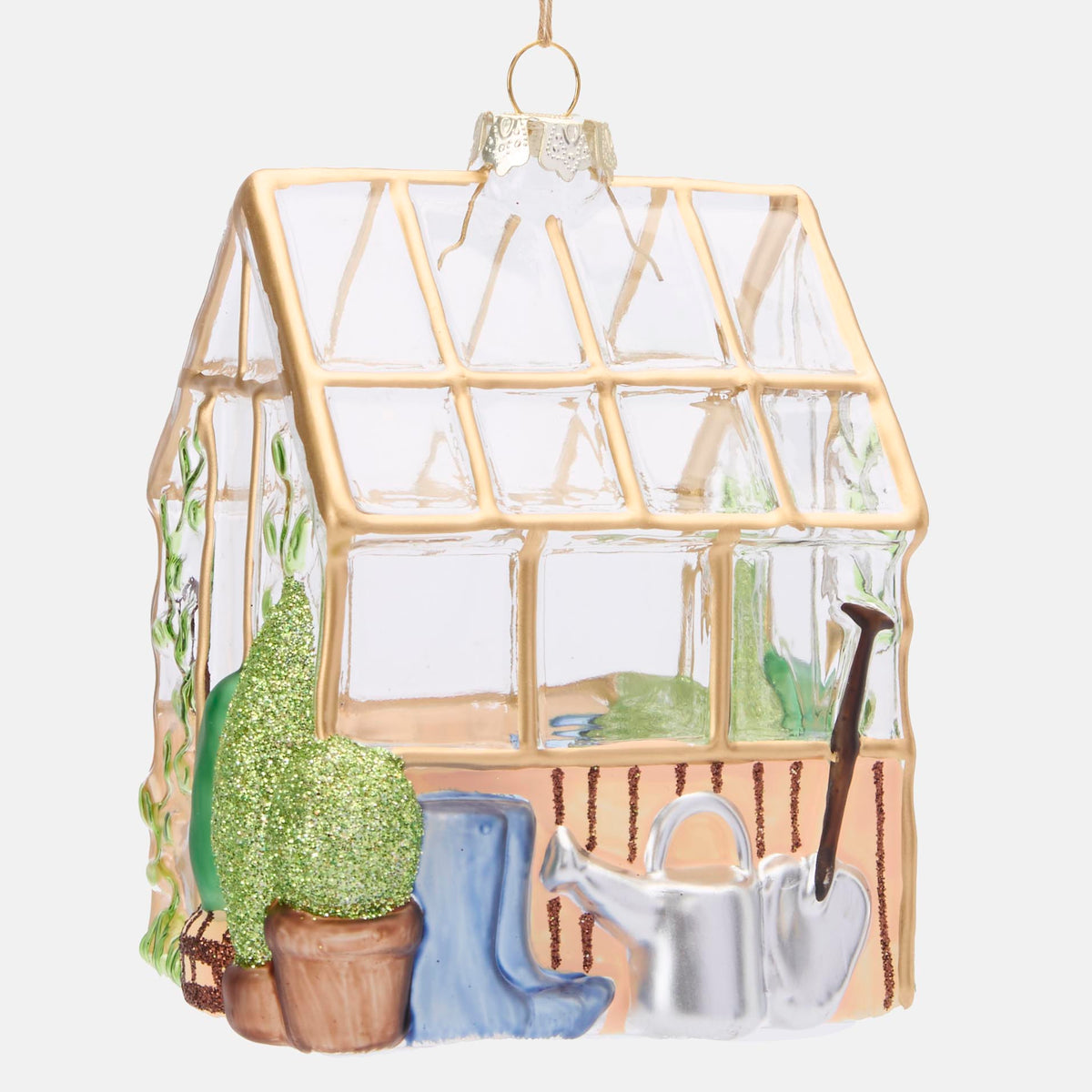 Glass greenhouse hanging decoration with gold framing, green plants, blue boots and silver watering can