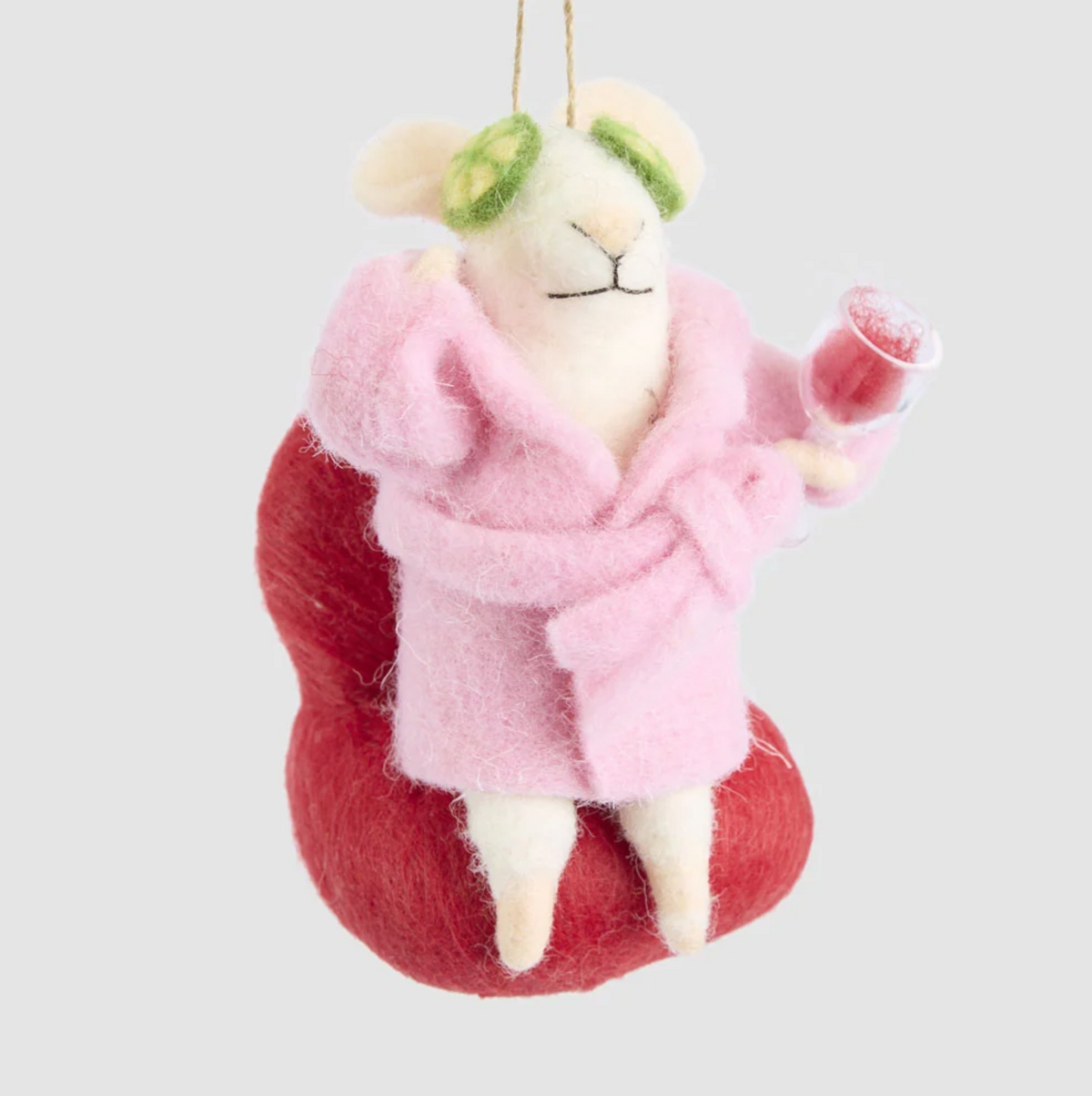 Front view of the pampered mouse decoration showing its pink belted dressing gown, red chair and raised wine glass