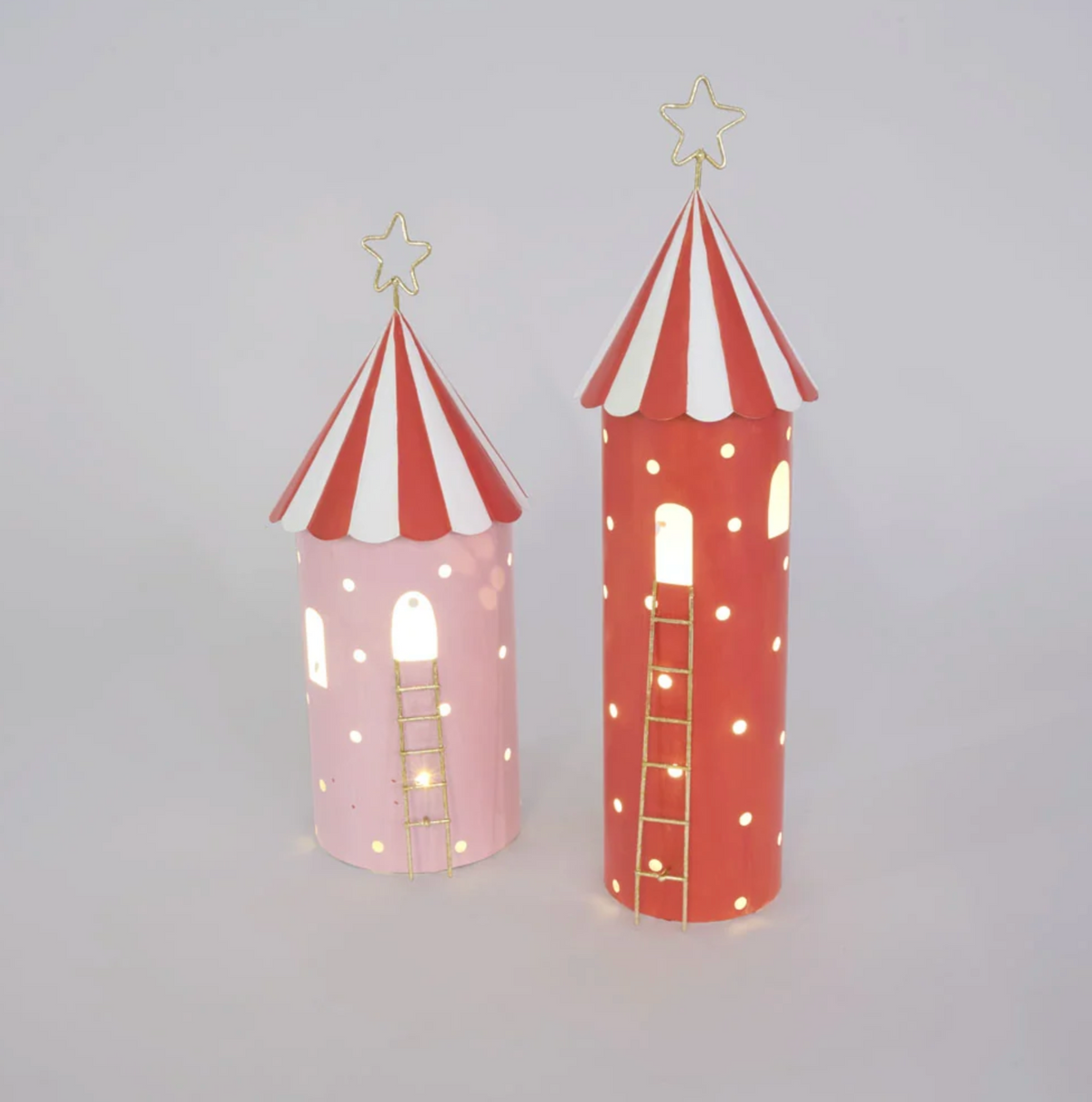 Pink metal LED tent illuminated through arched windows and circular openings