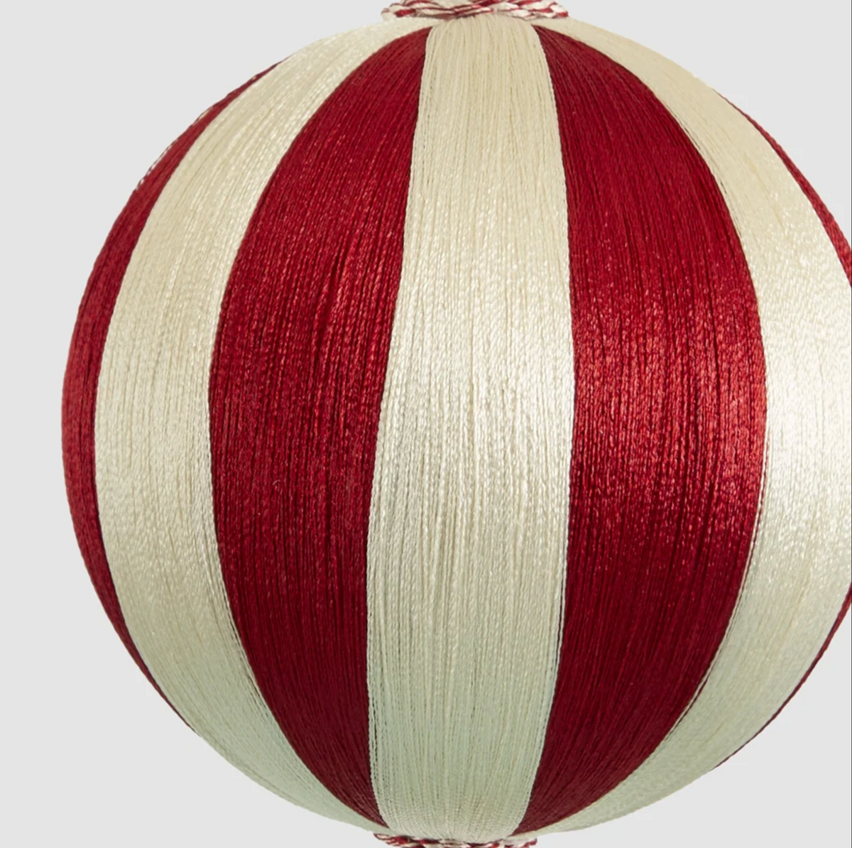 Close-up of the medium bauble showing alternating red and ivory stripes