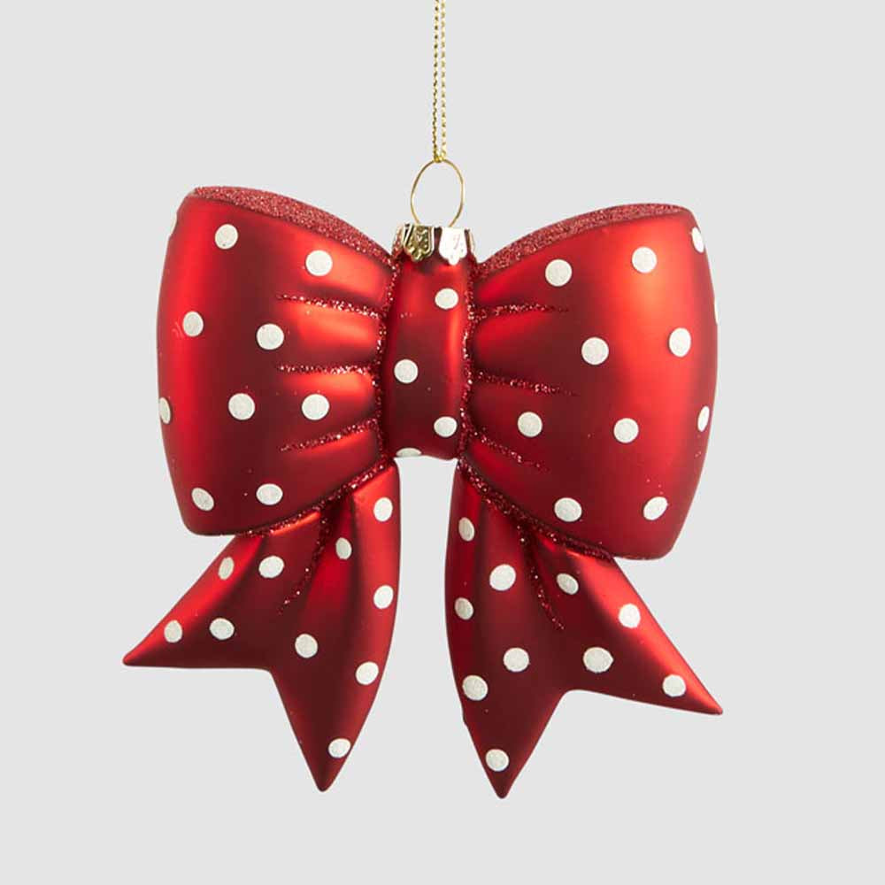 Red glass bow hanging decoration with white spots, glitter-edged folds and notched tails