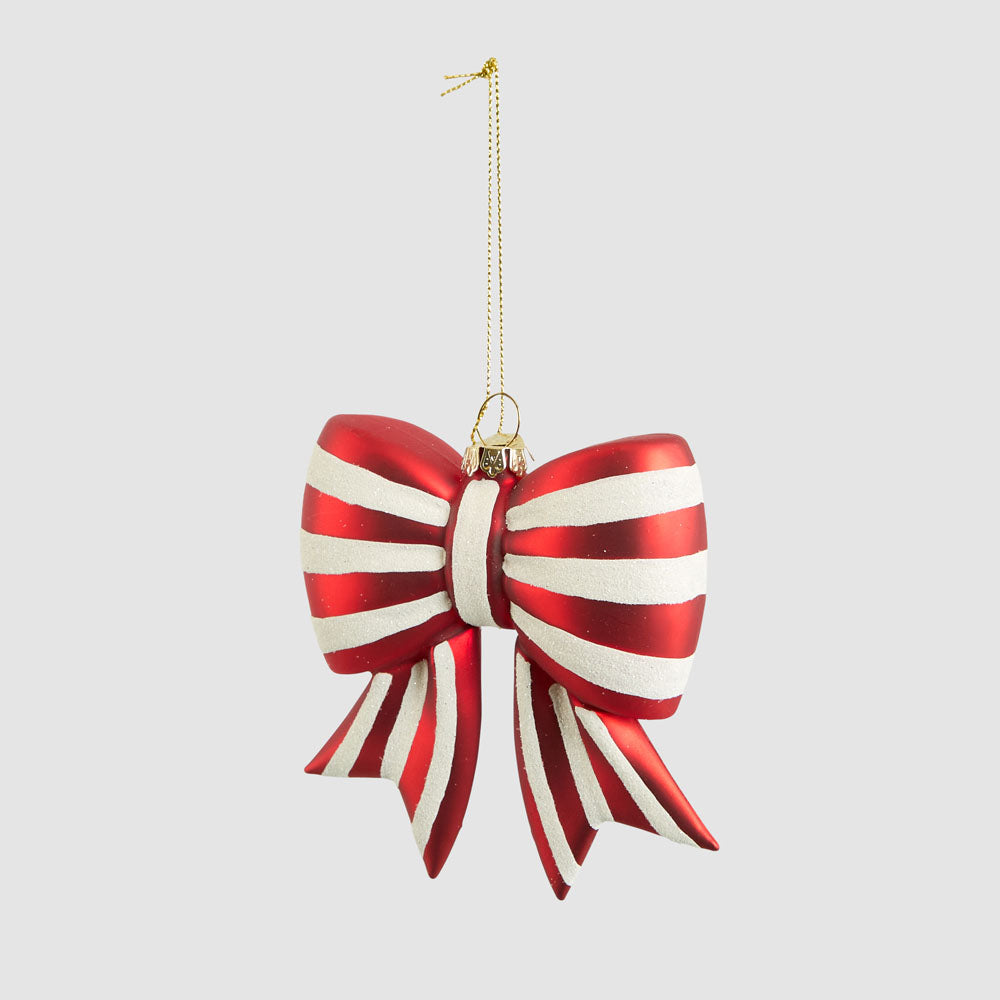 Angled view of the red and white striped glass bow showing the full hanging cord
